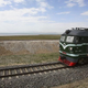 Freight train on tracks in barren landscape